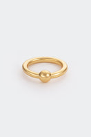 Gold flow ring by Poché featuring a sleek, minimalist design, showcased on a plain background.