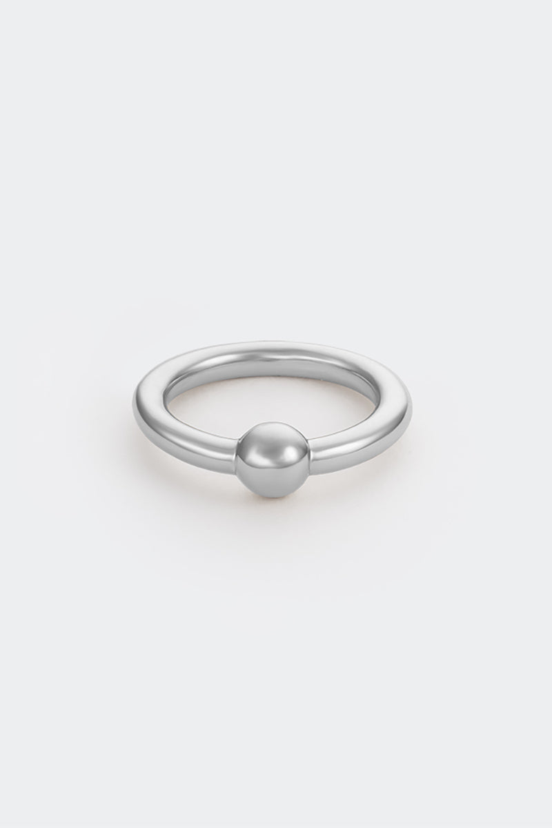Silver Flow Ring by Poché, a sleek, minimalist silver ring with flowing design, displayed on a plain background.