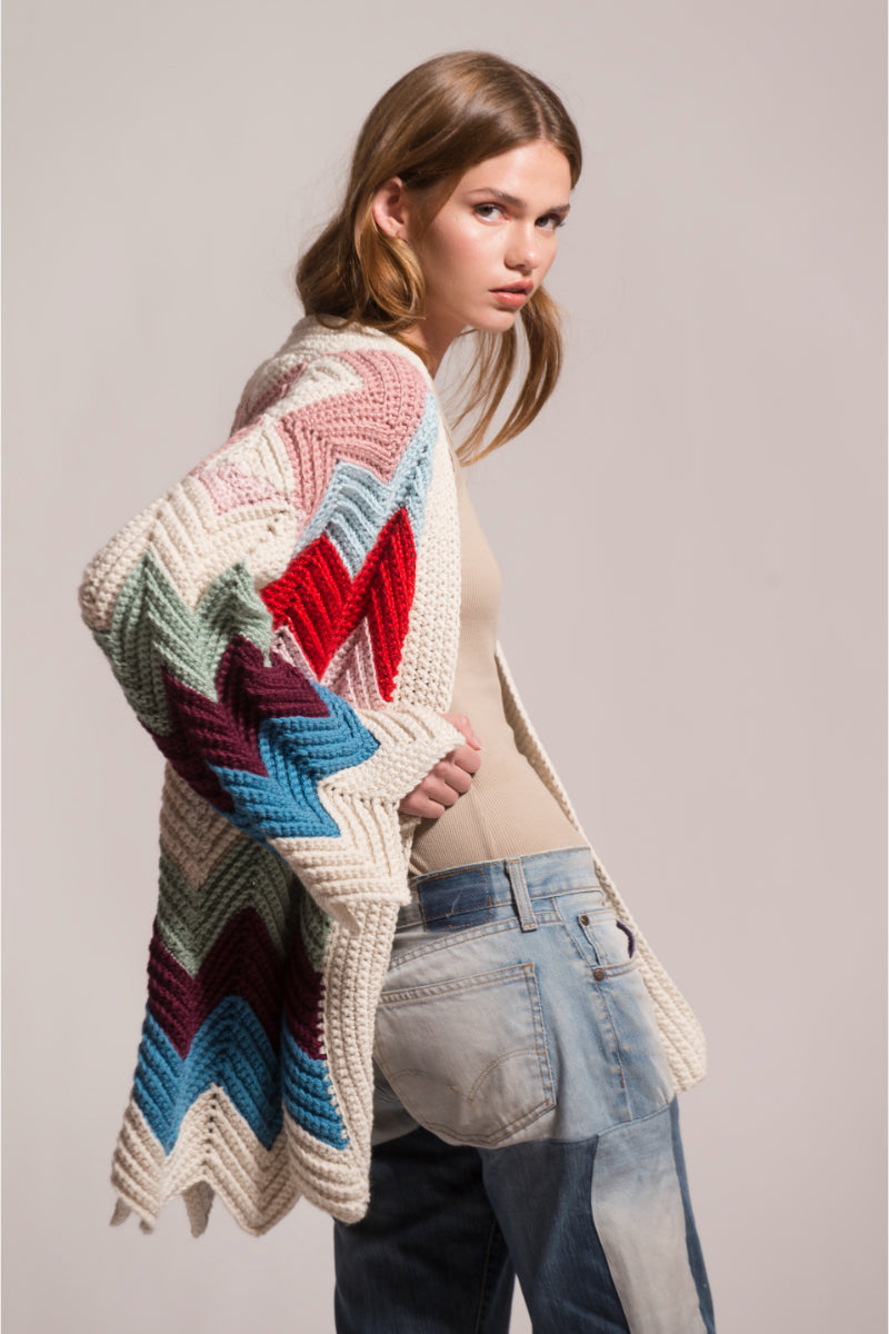 First Born Knits Ziggy knitted cardigan shown in a cozy, stylish design with a button-up front and textured knit pattern.
