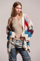 First Born Knits Ziggy knitted cardigan shown in a cozy, textured design with a button-up front and ribbed cuffs.