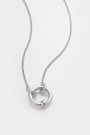 Silver Flow Necklace by Poché, featuring a sleek, modern design with smooth curves, displayed on a neutral background.