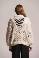 First Born Knits DAFNE knitted sweater featuring cozy, textured fabric in a stylish design.