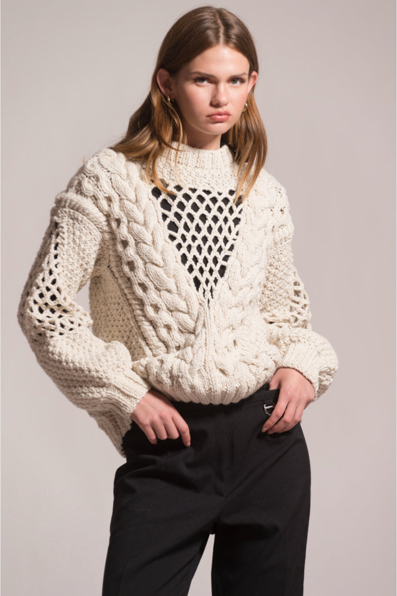 First Born Knits DAFNE knitted sweater, cozy and stylish, featuring a textured knit pattern in a neutral color.