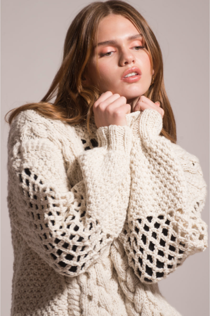 First Born Knits Dafne knitted sweater in cozy, textured fabric, shown on a mannequin with a neutral background.