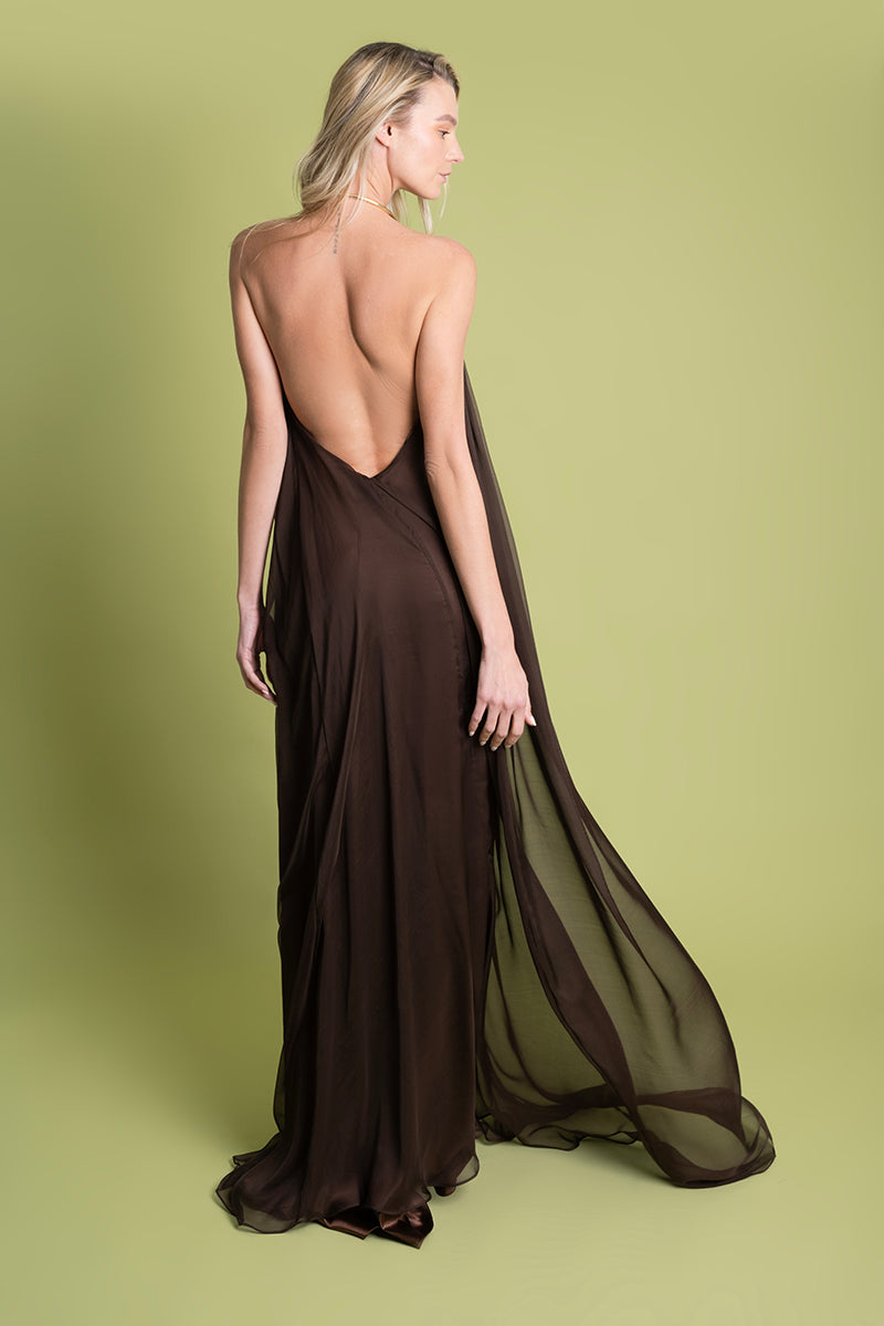 Brown Portobello maxi dress by Laura Escobar, flowing fabric and elegant design, shown on a model.