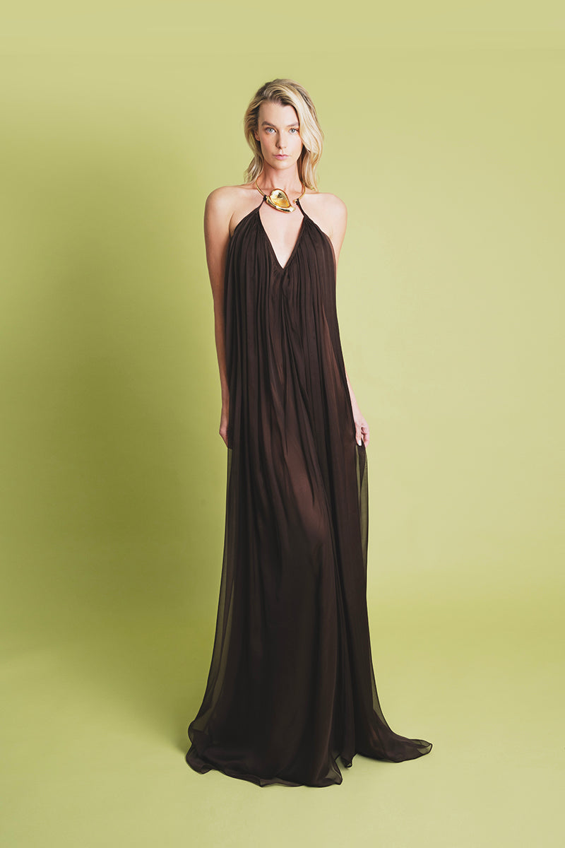 Laura Escobar Portobello brown maxi dress with flowing fabric and sleeveless design, perfect for casual or formal occasions.