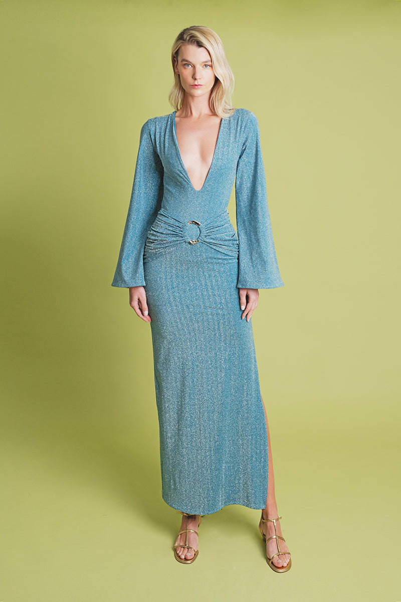 Blue Centella maxi dress by Laura Escobar, flowing fabric with a relaxed fit, showcased on a model in a natural outdoor setting.