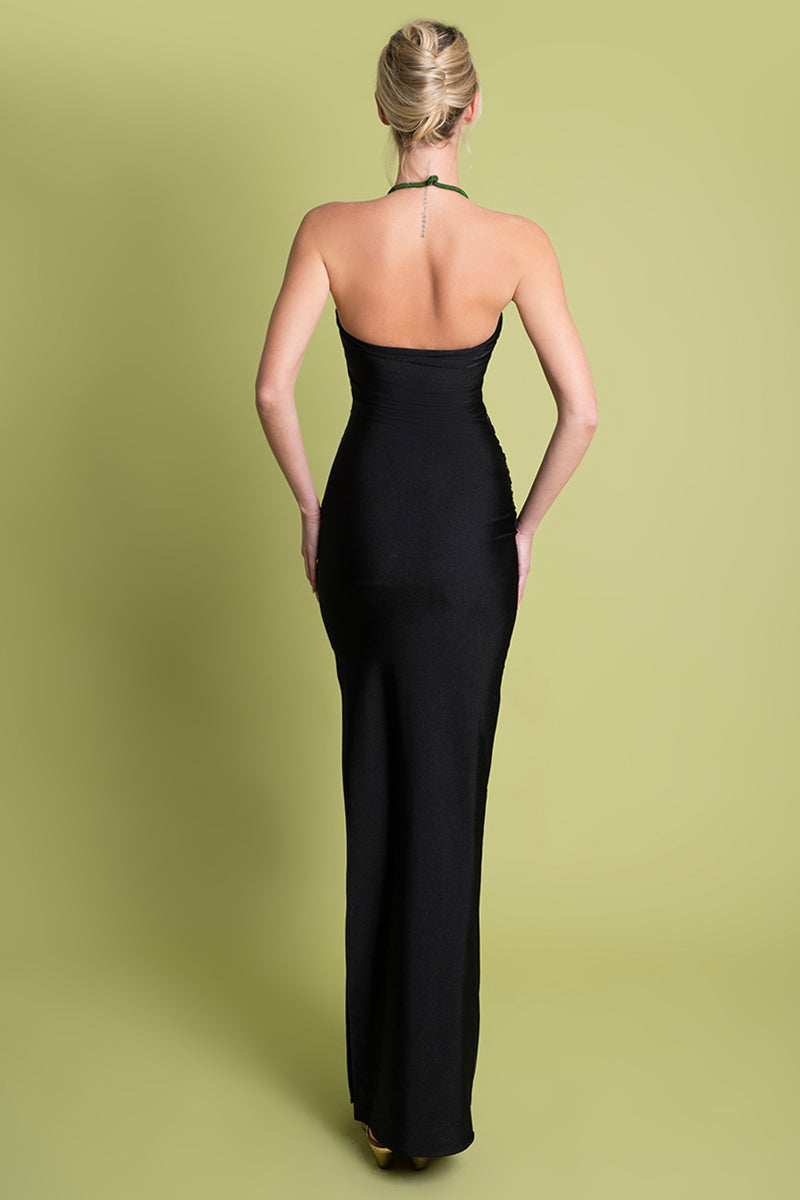 Black maxi dress by Laura Escobar featuring a flowing silhouette and elegant design, perfect for formal or casual wear.