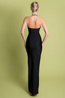 Black Paula maxi dress by Laura Escobar, flowing fabric and elegant design, shown on a model in a stylish photoshoot.