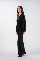 MASTANI KAIA silk pant and ASIN twill top co-ord set, featuring elegant silk pants and a stylish twill top, on a hanger.