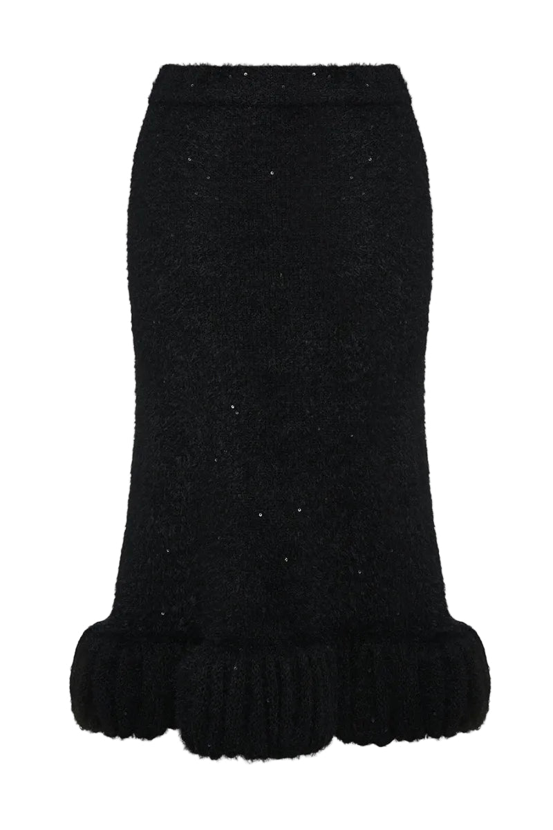 Black Lalo midi skirt with high-waisted, knitted textured design, showcasing its elegant flow and detailed fabric.