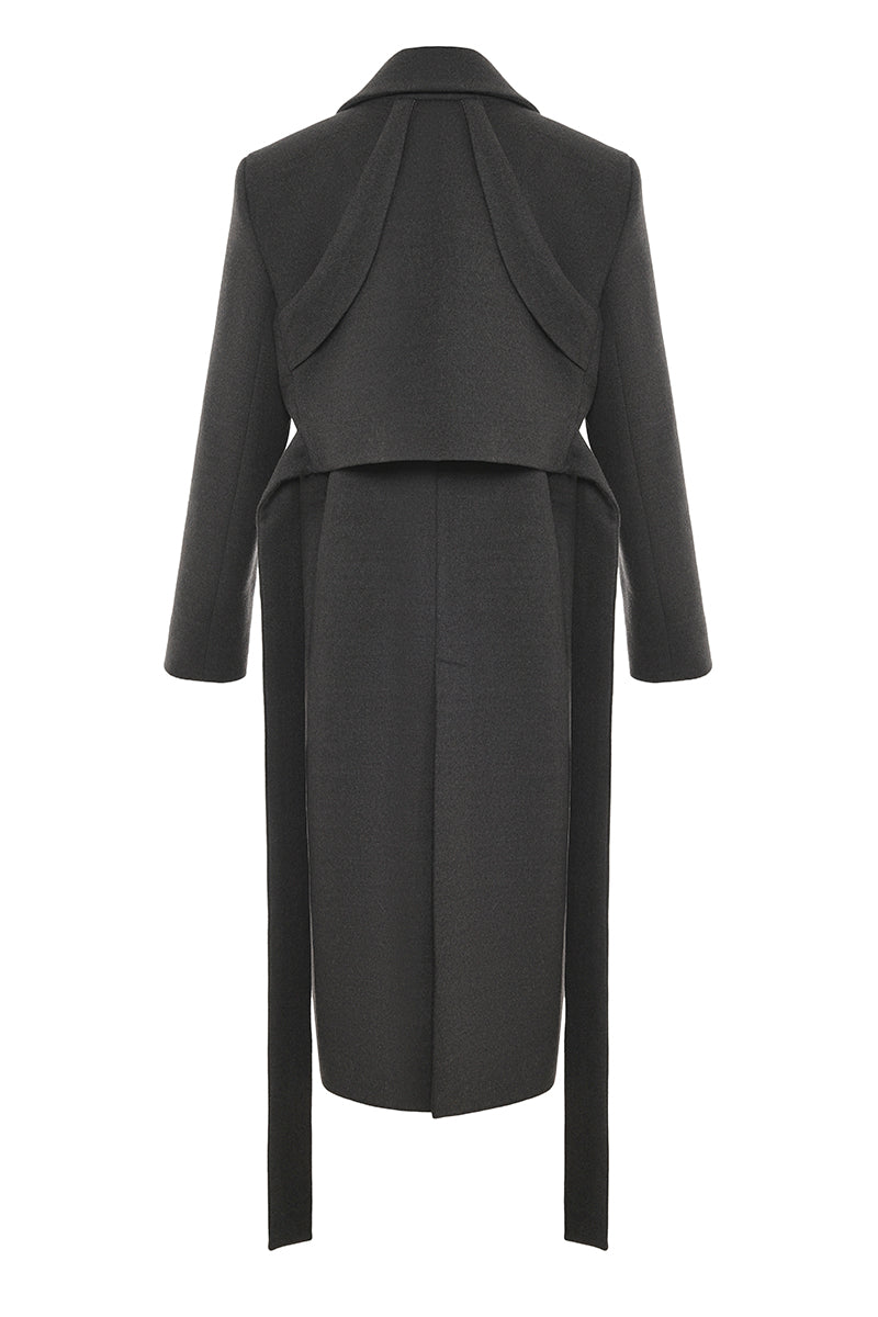 Gvasalia double-breasted coat with detailed back design, tailored fit, and classic collar, displayed on a hanger.