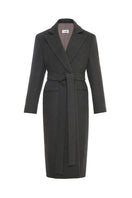 Gvasalia double-breasted coat with back detailing, tailored fit, and classic lapel design, displayed on a hanger.