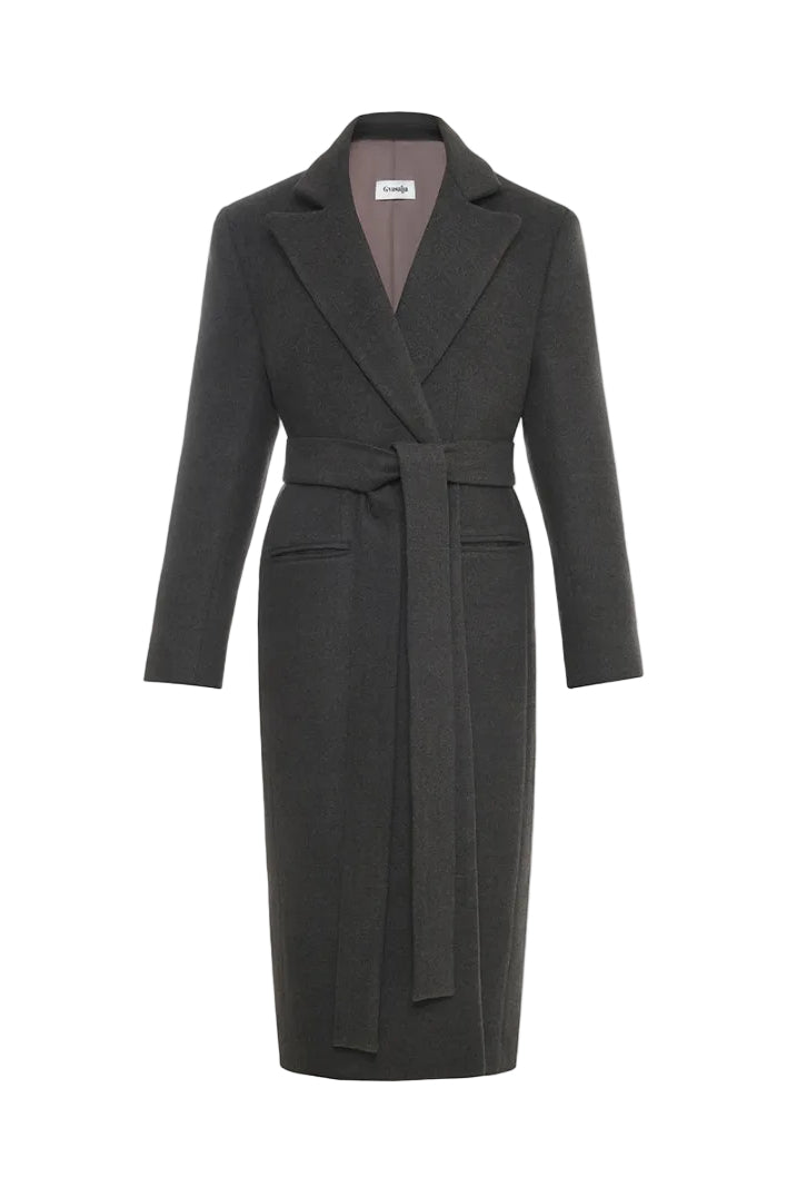 Gvasalia double-breasted coat with back detailing, tailored fit, and classic lapel design, displayed on a hanger.