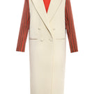 Gvasalia double breasted coat with striped sleeves, tailored fit, and classic design, displayed on a hanger.
