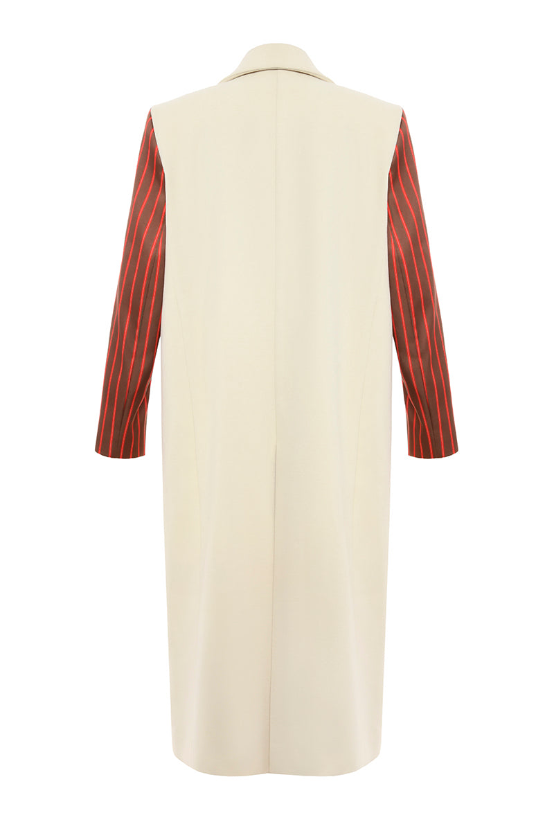 Gvasalia double-breasted coat with striped sleeves, stylish outerwear featuring classic design and bold contrasting details.