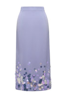 Lalo purple midi knitted skirt with embellishment detailing, featuring a flowing maxi design and textured fabric.