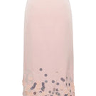 Pink midi knitted skirt with embellishment detailing by Lalo, featuring a flowy maxi skirt design and textured knit fabric.