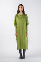 Mastani NANI shirt dress in midi length, featuring a stylish design with a collar and button details, displayed on a hanger.