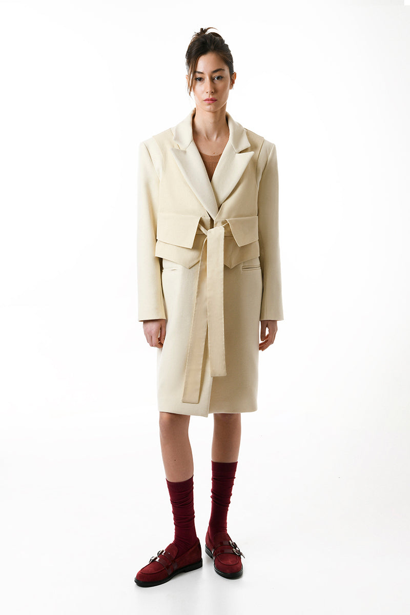 Gvasalia double-breasted coat with matching vest, stylish outerwear featuring classic tailoring and button details.