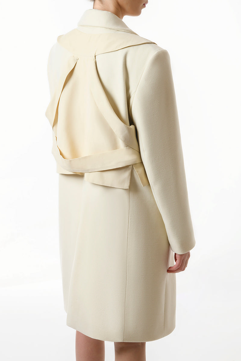 Gvasalia double-breasted coat with matching vest, tailored fit, in a neutral color, displayed on a hanger.
