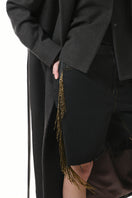 Gvasalia double-breasted coat with back detailing, tailored fit, and classic lapels, shown in a stylish front view.