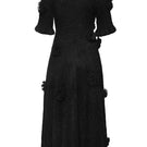 Black Lalo draped A-line maxi dress with floral details, featuring a flowing silhouette and elegant design.