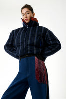 Gvasalia two-tone puffer coat with double collar detail, featuring a stylish, padded design and contrasting fabric on a model.
