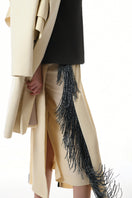 Gvasalia double-breasted midi skirt with beaded fringe detailing, showcasing a stylish and elegant design.