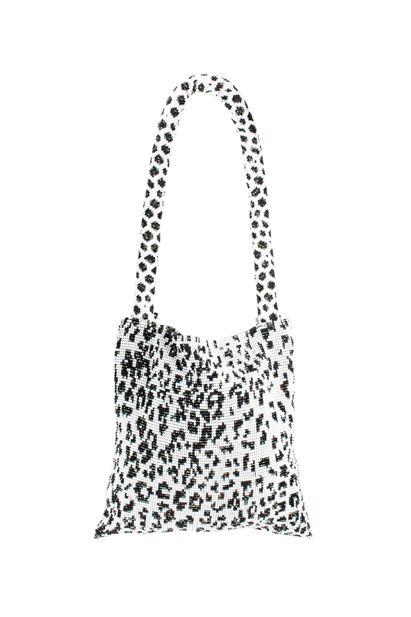Snow leopard print SAC DE SOUL Serpent shoulder bag with gold-tone hardware and adjustable strap, stylish and versatile accessory.