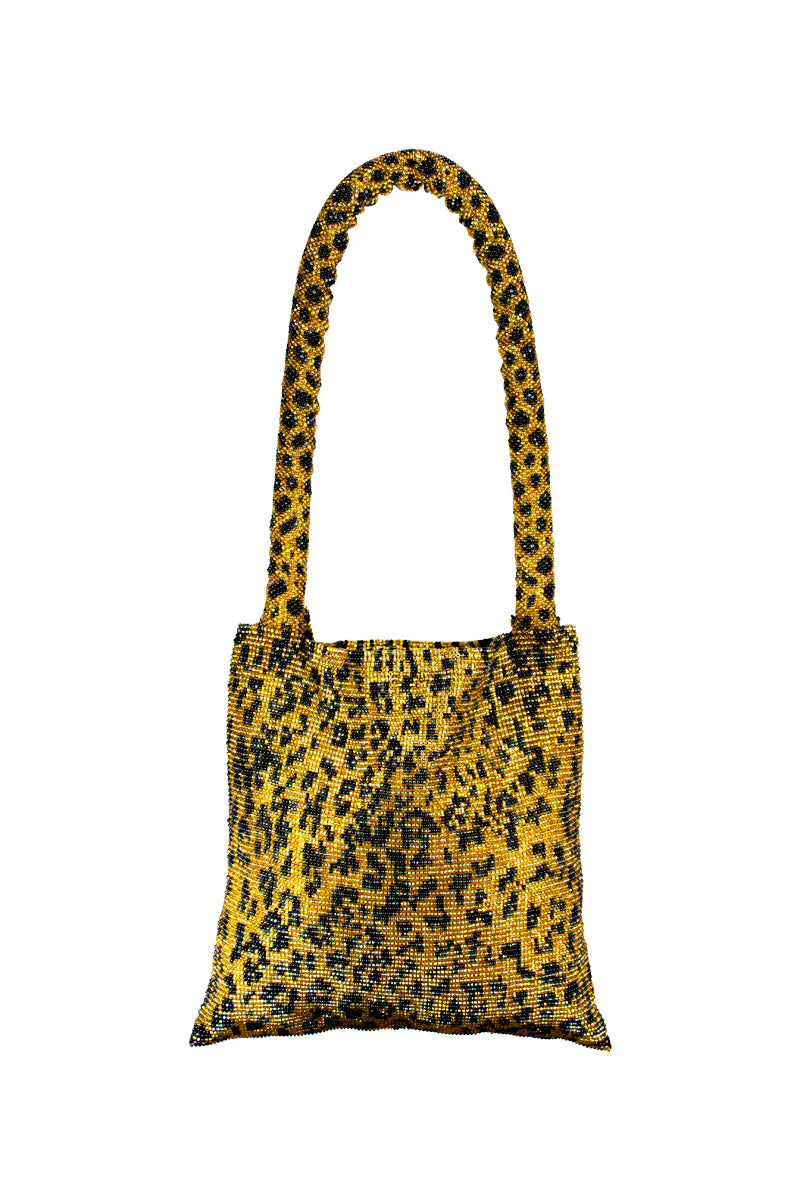 Leopard print Serpent shoulder bag by SAC DE SOUL, stylish accessory with snake-inspired design and adjustable strap.