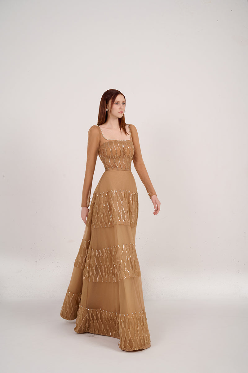 Long-sleeved brown square-neck gown by Happy Clothing, featuring a flowing silhouette and elegant design, shown on a model.