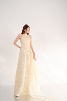 Elegant halter neck gown with floral details from Happy Clothing, featuring flowing fabric and intricate floral embellishments.