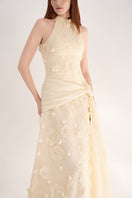 Elegant halter neck gown with floral details by Happy Clothing, featuring a flowing design and intricate floral embellishments.