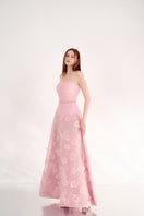 Pink strapless gown with floral details by Happy Clothing, featuring a flowing design and elegant fabric.
