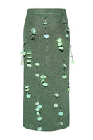 Lalo hand-knit green maxi skirt with embellishments, featuring a flowing design and intricate details.