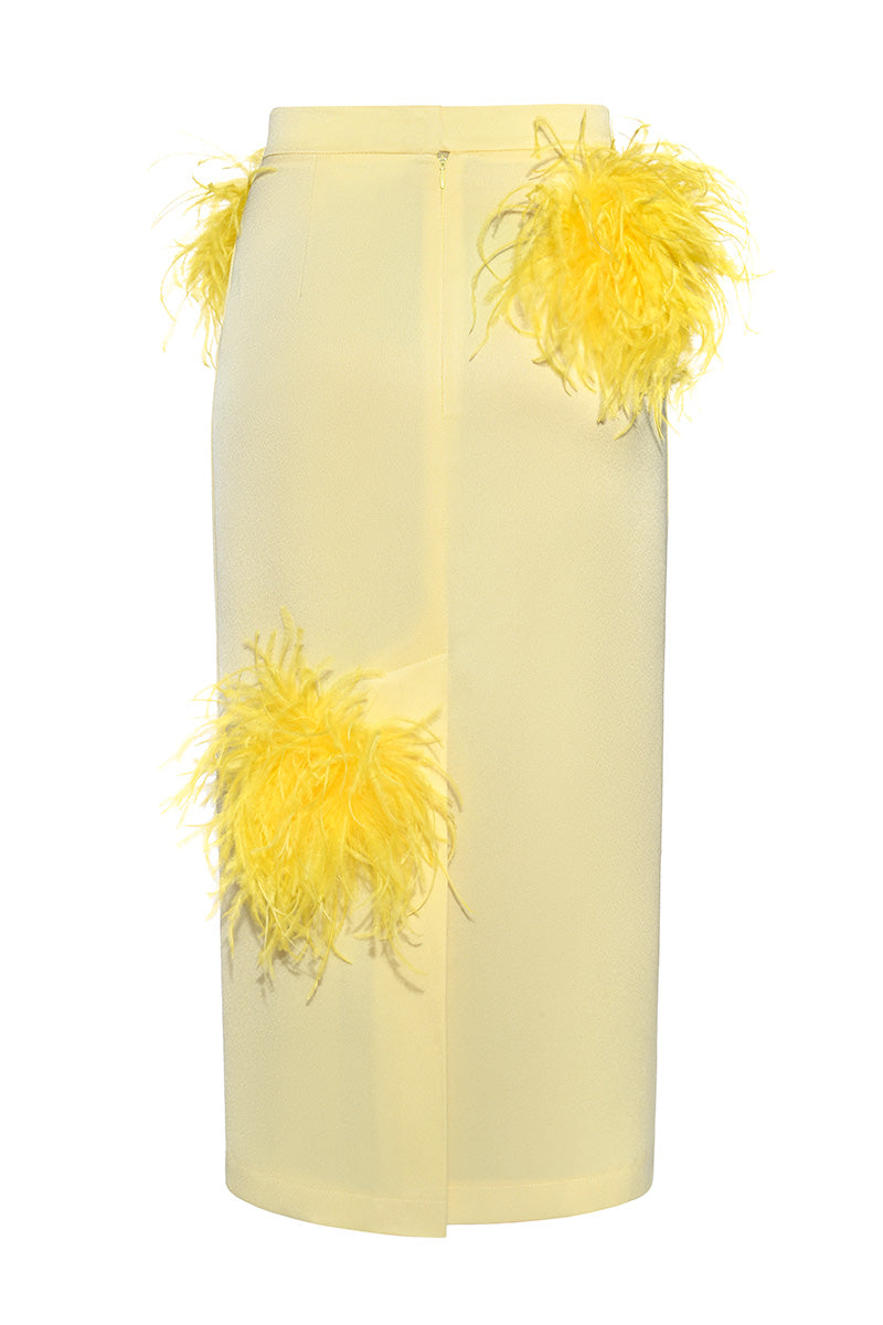 Lalo butter yellow midi pencil skirt with feather details, fitted design, and side slit, styled for elegant fashion.