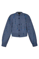 Blue hand-knit Lalo cardigan with embellished details, featuring a cozy, textured knit pattern and button closure.
