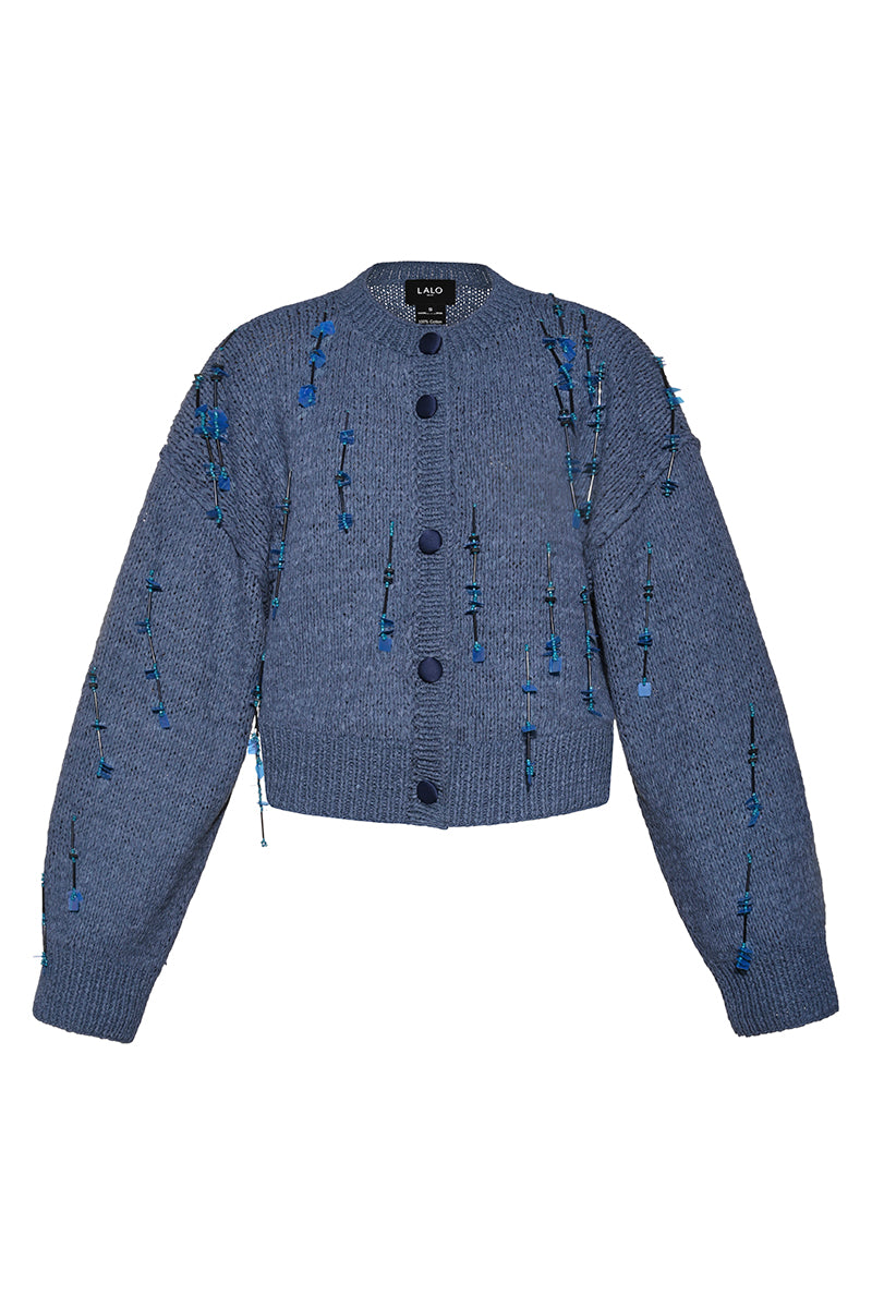 Blue hand-knit Lalo cardigan with embellished details, featuring a cozy, textured knit pattern and button closure.