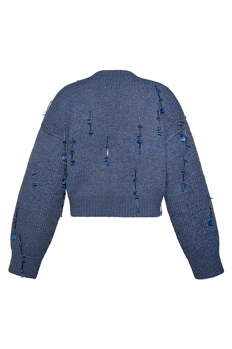 Hand-knit blue cardigan with embellishments by Lalo, featuring intricate details and cozy, stylish design.