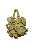 Lalo handcrafted ruffle raffia shoulder bag with woven texture, featuring ruffle details and natural straw finish.