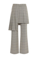 Beige checkered removable skirt-pants by Gvasalia, featuring a stylish blend of skirt and pant elements, displayed on a model.