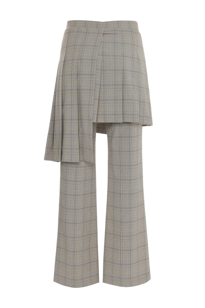 Beige checkered removable skirt-pants by Gvasalia, featuring a stylish blend of skirt and pant elements, displayed on a model.