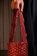 Copper and magenta seashell shoulder bag by VERDI with intricate design and shoulder strap, stylish accessory for casual or evening wear.