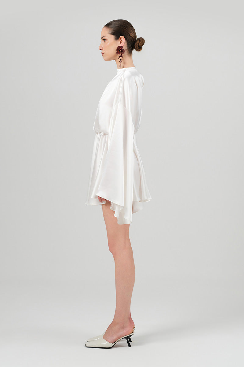 White Nina dress from Izakova, a stylish mini dress featuring a sleek design and soft fabric, perfect for casual or dressy occasions.