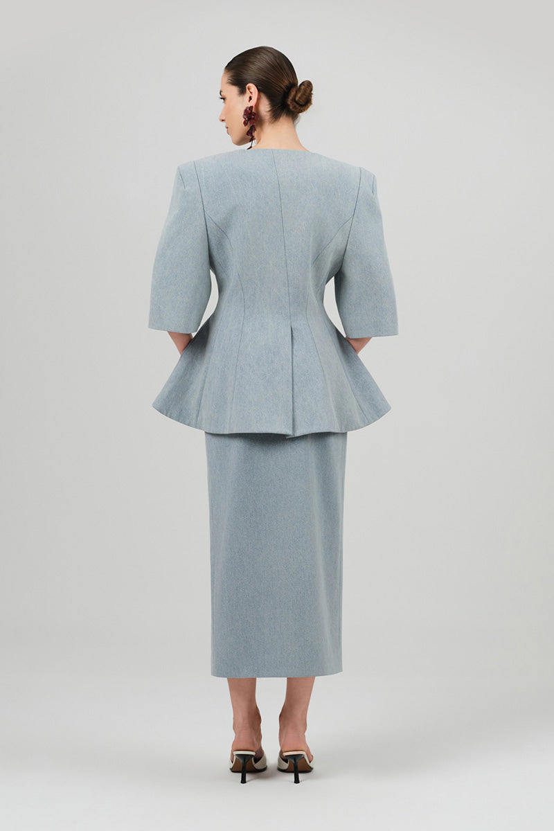 Izakova NEDA washed blue midi skirt with a flowy design, shown on a model, perfect for casual or semi-formal outfits.
