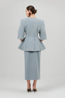 Izakova NEDA washed blue midi skirt with a flowy, lightweight fabric and a high waist, displayed on a hanger.