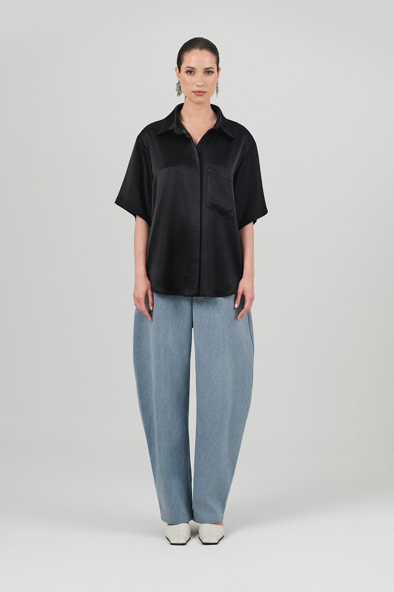 Black satin Rosa shirt by Izakova, featuring a sleek fit and smooth fabric, perfect for stylish and elegant outfits.