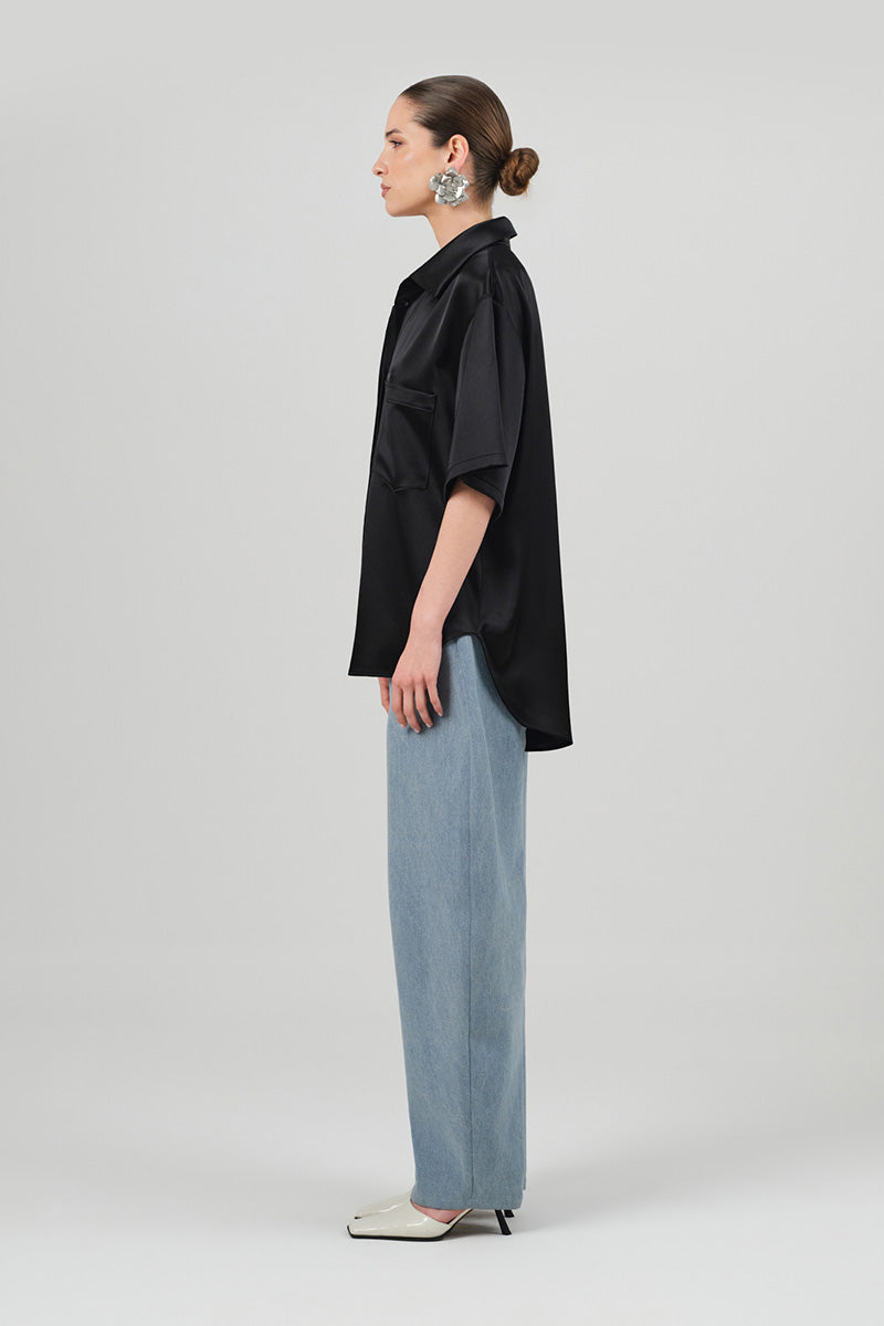 Black satin Rosa shirt by Izakova, showcasing elegant fabric and tailored fit, perfect for stylish occasions.