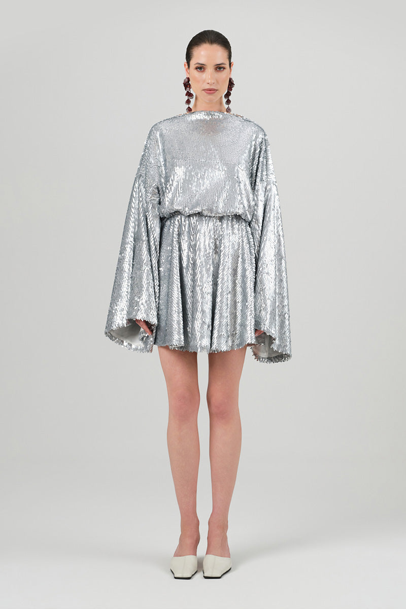 Silver sequin Nina dress by Izakova, a stylish mini dress with shimmering embellishments and a fitted silhouette.